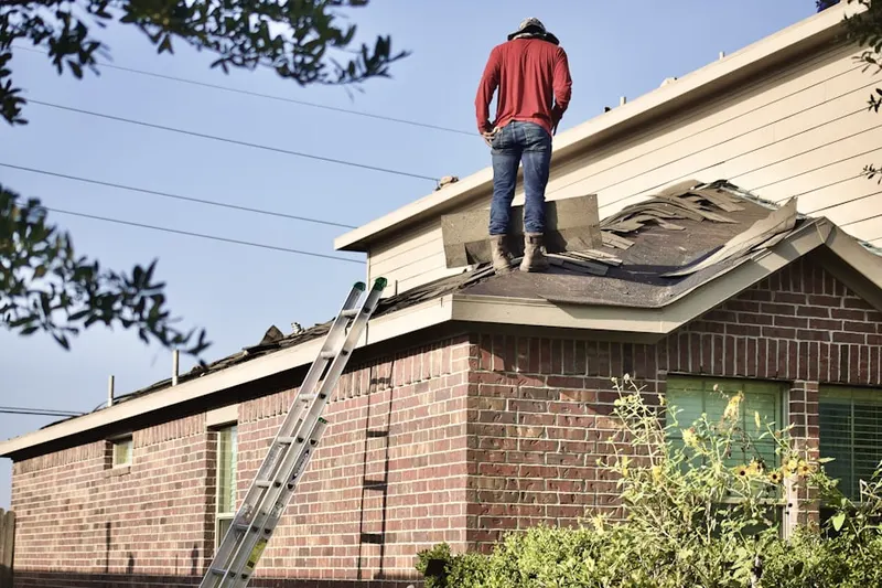 Professional roofer working on a residential roof in Morgan Park